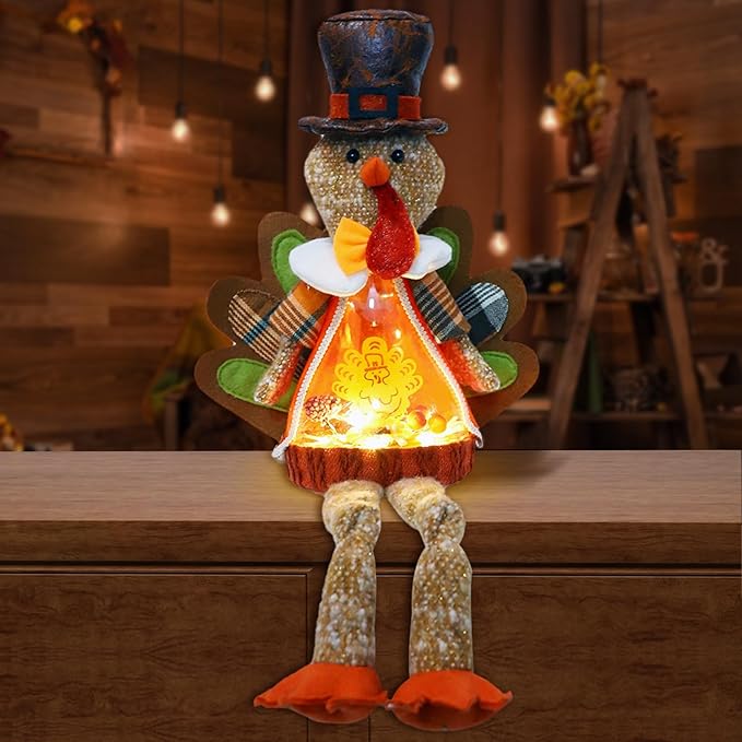 Light-up plush turkey doll with top hat, glowing orange chest, brown body, orange feet