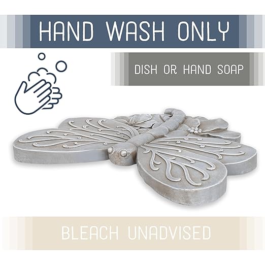 Grey dragonfly cast resin stepping stone with detailed raised wings and flower-like center