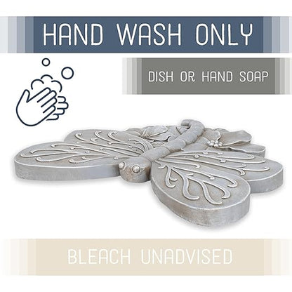 Grey dragonfly cast resin stepping stone with detailed raised wings and flower-like center