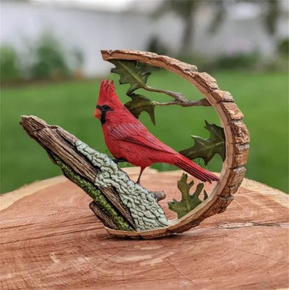 Wooden cardinal bird sculpture with red cardinal perched on textured branch in leaf arch
