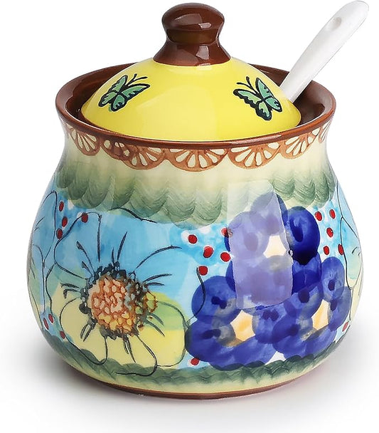 Hand-painted ceramic sugar bowl with lid and spoon, blue and yellow floral pattern