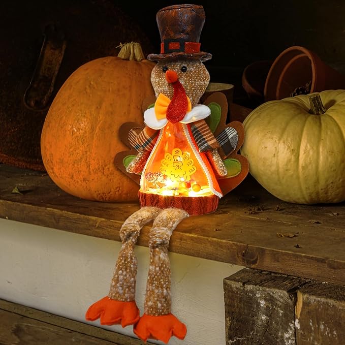 Light-up plush turkey doll with top hat, patterned vest, glowing orange chest, long brown legs