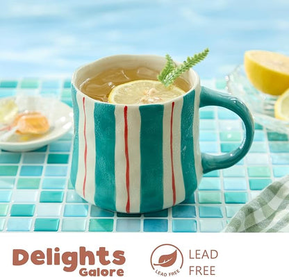 12oz ceramic coffee mug with teal and red vertical stripes, lemon slice in cup