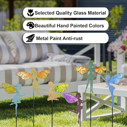 Multicolor fairy garden stakes with decorative glass wing details in lawn
