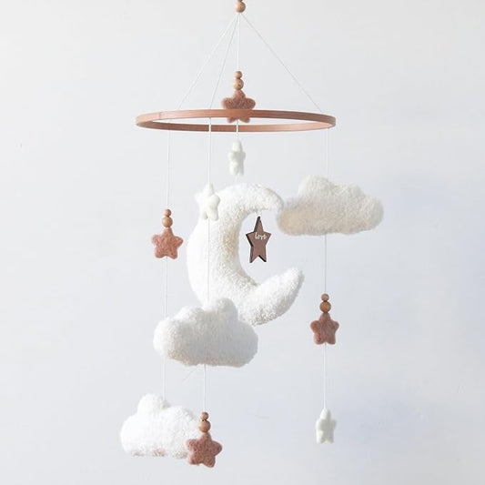 Crib mobile with white plush clouds, crescent moon, stars, and wooden bead hangers
