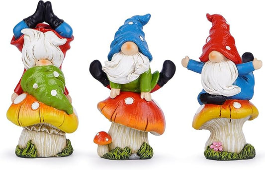 Three mushroom gnome figurines with blue, green, and red caps and white beards, front view