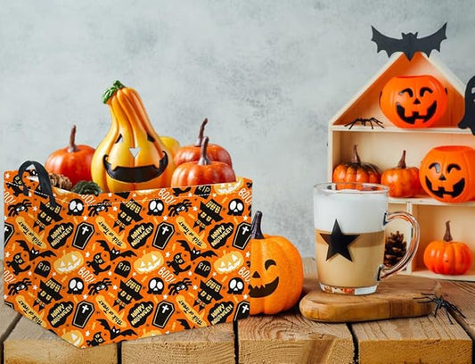 Orange Halloween trick-or-treat basket with black spooky spider pattern and two handles