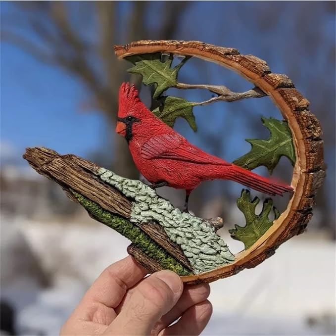 Wooden cardinal bird sculpture held in hand, red cardinal on leaf-and-branch arch