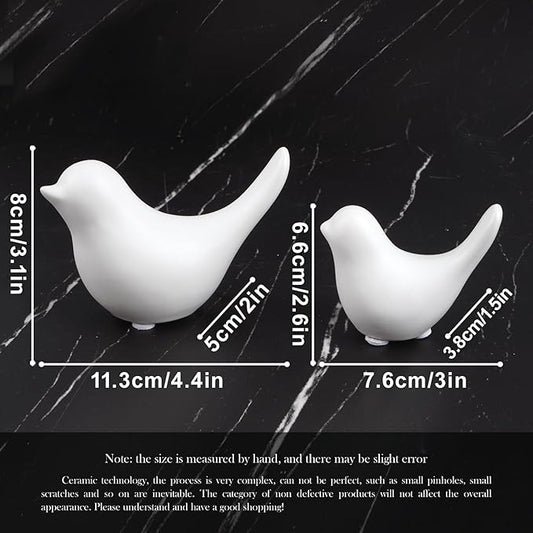 Ceramic white bird figurine set of 2 with size markings, curved sculpted silhouettes