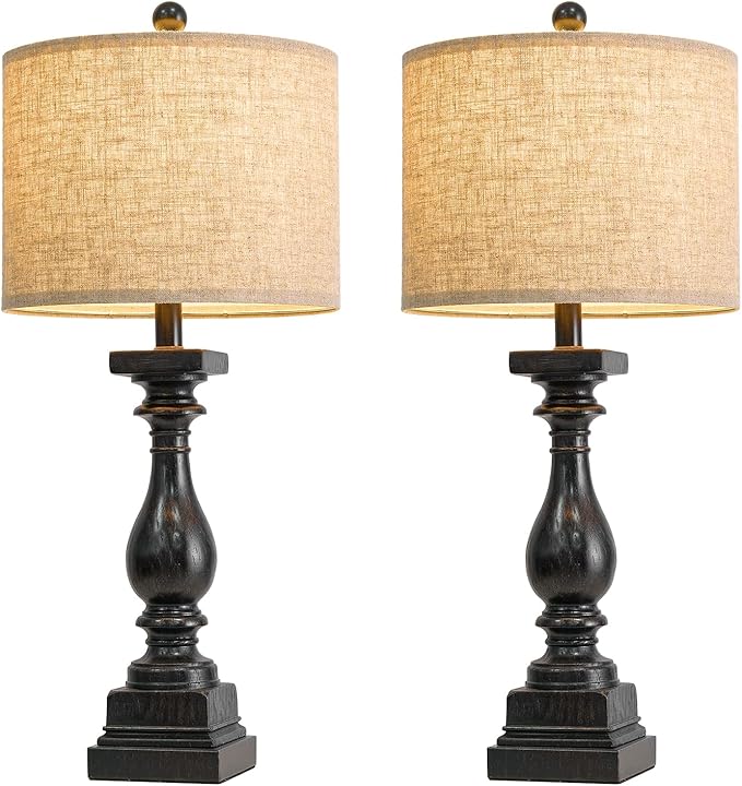 Front view pair of farmhouse table lamps with beige fabric shades and dark black bases