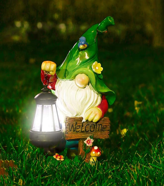 Green garden gnome resin statue with glowing solar lantern and welcome sign