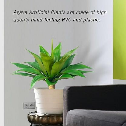 Green faux agave plant with spiky leaves in white textured planter
