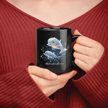 Black mug with blue dolphin Christmas graphic and custom name, held near chest