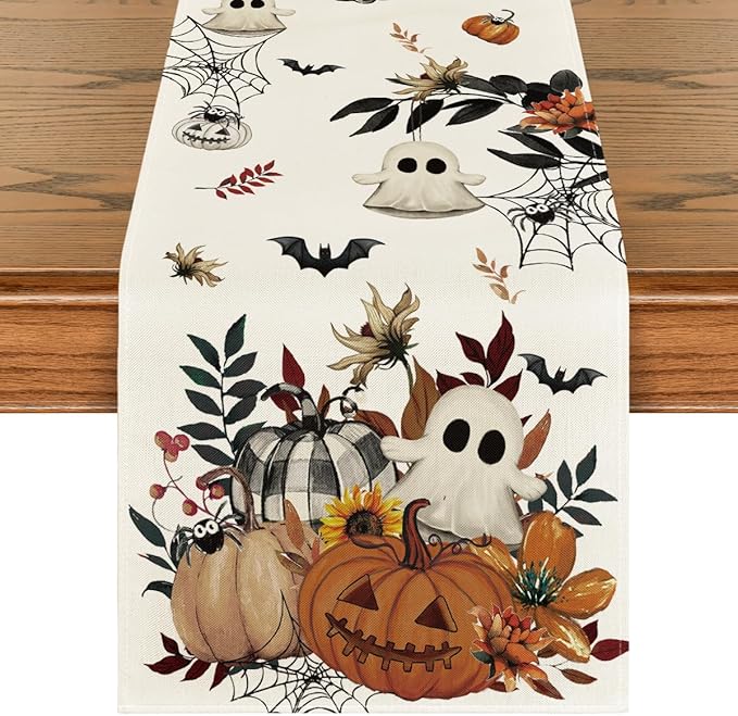 Beige Halloween table runner with pumpkins, ghost, spiderweb and bats