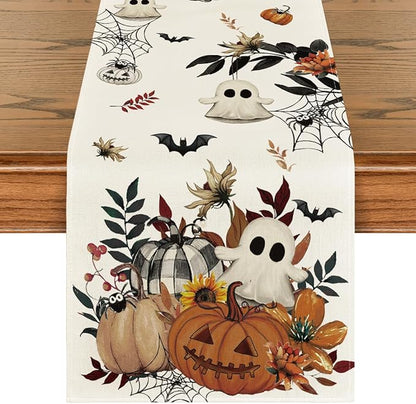 Beige Halloween table runner with pumpkins, ghost, spiderweb and bats