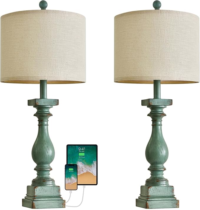 Front view pair of green resin table lamps with beige shades and charging devices