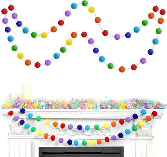 Rainbow felt pom-pom garland with multicolor fuzzy balls, curved across a mantel
