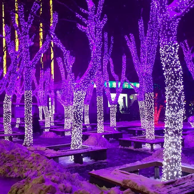 Purple LED tree string lights forming tall cascading rows along outdoor steps