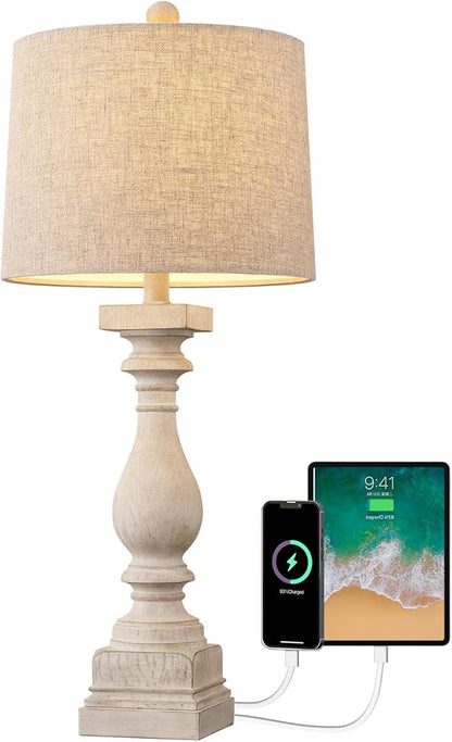 Table lamp with beige fabric shade and USB charging ports for phone