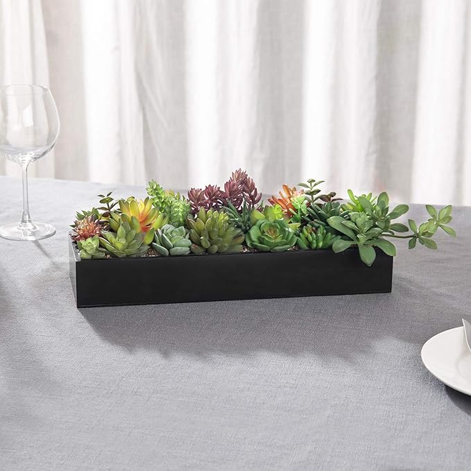 Black rectangular planter faux succulents centerpiece with green and purple foliage