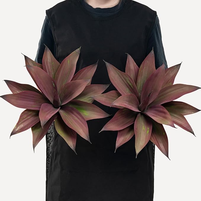 Purple-red artificial agave plant with layered spiky leaves and green stem.