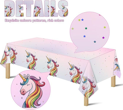 Unicorn plastic tablecloth with rainbow unicorn pattern, pink stars, and wide side drape
