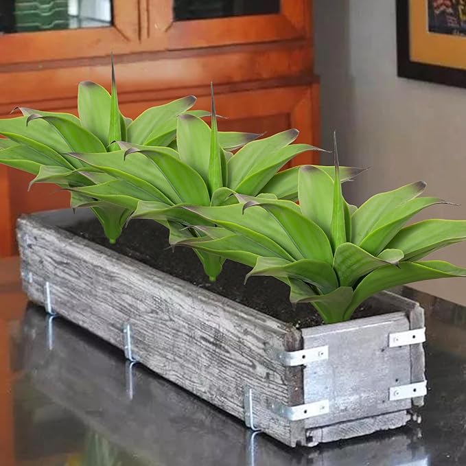 Two dark green faux agave plants in a rectangular gray planter box