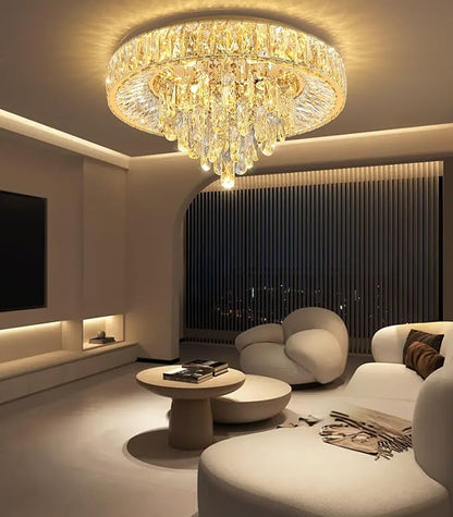 Gold-tone crystal flush mount chandelier with warm light glow in modern living room