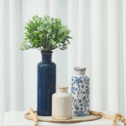 Set of 3 ceramic vases: tall dark blue, cream, and blue-and-white patterned
