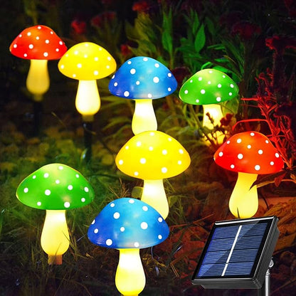 Set of 8 colorful solar mushroom LED lights with spotted caps and glowing stems