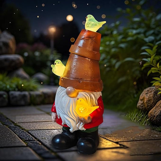 Solar gnome figurine with stacked brown body, glowing birds, white beard and red coat