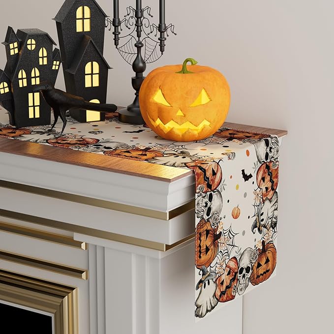 Halloween table runner laid on a console with skeleton and pumpkin print in orange