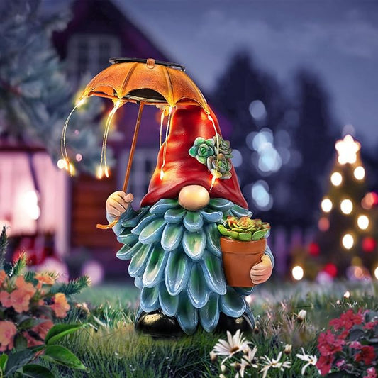 Solar gnome garden statue with orange umbrella and glowing LED lights, red robe, blue beard.