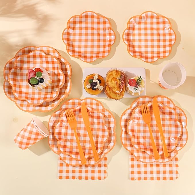 Orange and white gingham party tableware set with plates, napkins, forks, and cups