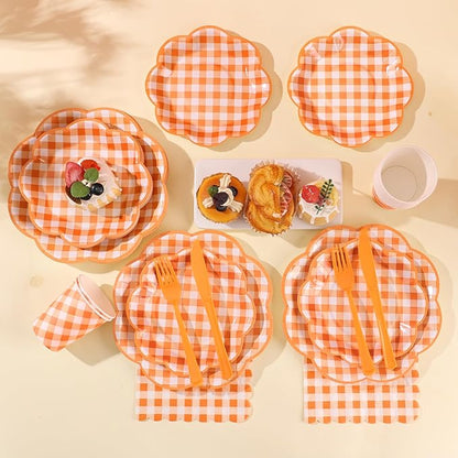 Orange and white gingham party tableware set with plates, napkins, forks, and cups