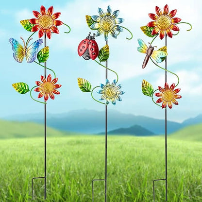 Three metal garden stakes with sunflowers, butterflies, ladybug, and dragonfly yard decor