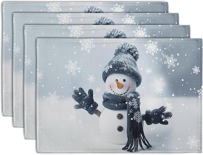 Blue snowman holiday placemats stacked, snowflake print, stitched border, set of 4