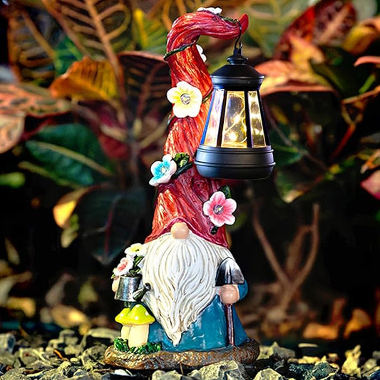 Red gnome garden statue holding an illuminated black solar lantern with flower accents