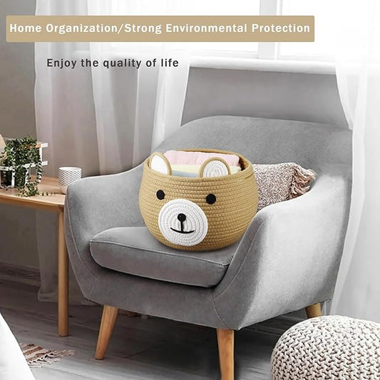 Tan round rope baby storage basket with bear face patch and carry handles