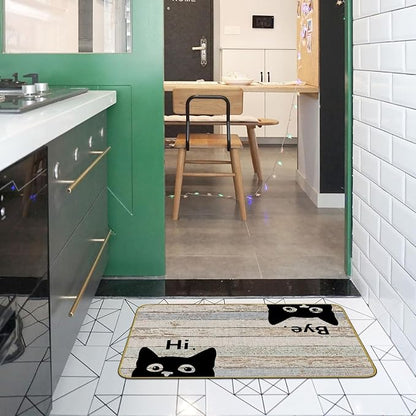 Grey kitchen entry doormat with black cat faces and “Hi” and “Bye” text