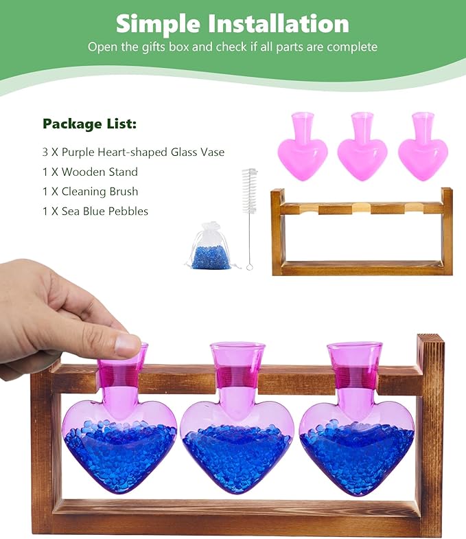 Wood stand with three purple heart-shaped glass vases, blue pebbles, and cleaning brush