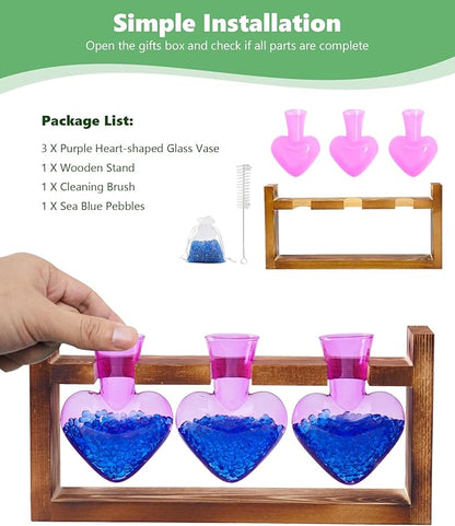 Wood stand with three purple heart-shaped glass vases, blue pebbles, and cleaning brush