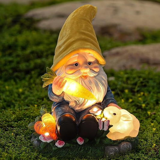 LED solar gnome garden figurine kneeling and feeding a rabbit, yellow hat, glowing carrot