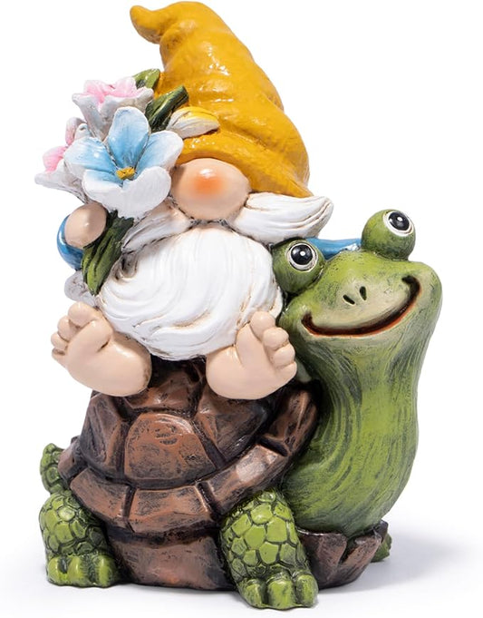 Garden gnome figurine in yellow hat holding flower bouquet on a green turtle