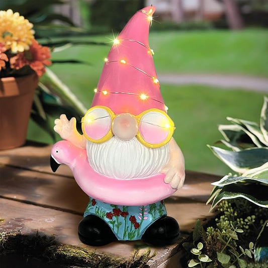 Pink flamingo garden gnome statue with warm LED string lights, round glasses, white beard