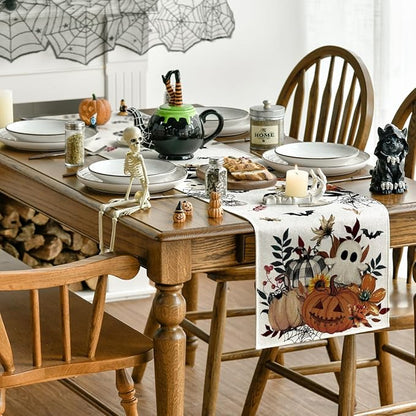 Beige Halloween table runner with pumpkin and ghost motif on dining table