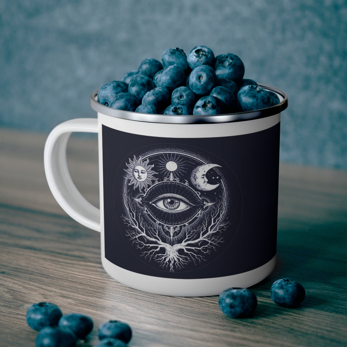 Enamel camping mug in dark navy with white rim and sacred eye illustration