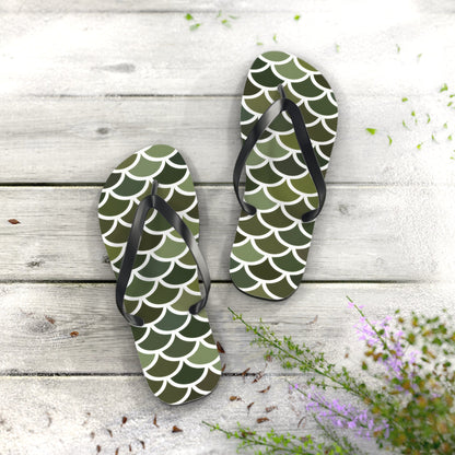 Two green scale print flip flops with black straps