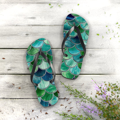 Mermaid-scale flip-flops, two sandals with black straps and layered green-blue scale print