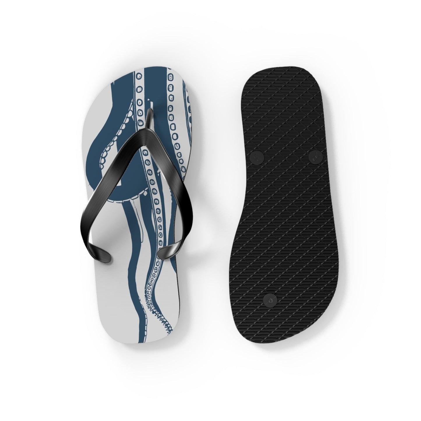 Octopus print flip-flops showing black textured outsole and blue patterned footbed